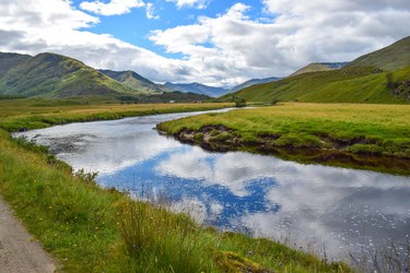 Image of a river with mountains in the background